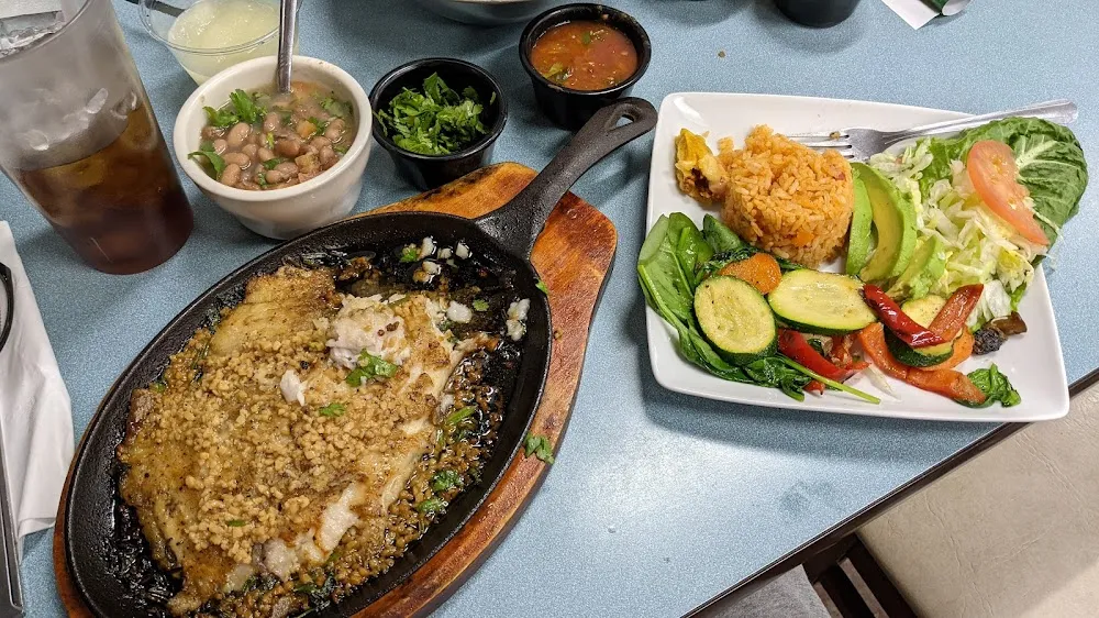 White Wine and Garlic Tilapia with Rancho Beans and Cilantro Rice and Sauteed Vegetables on Spinach
